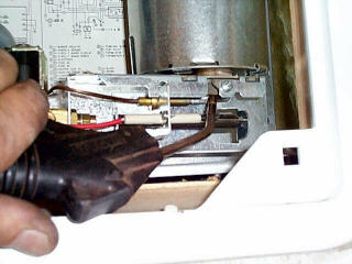 RV Refrigerator Repair - servicing the burner.